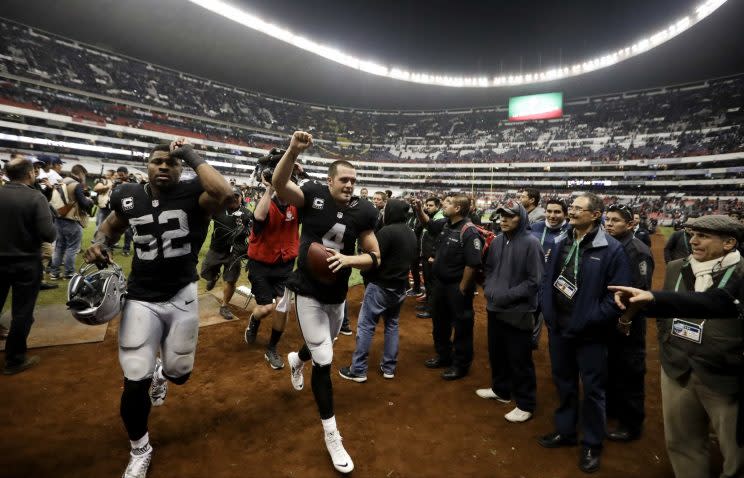 Khalil Mack and Derek Carr helped lead the Raiders back to the playoffs in 2016. (AP)