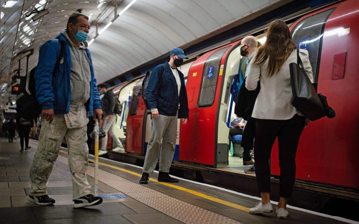 Commuters on a Northern line at 07:46 in central London, after Prime Minister Boris Johnson announced a range of new restrictions to combat the rise in coronavirus cases in England. PA Photo.  - Aaron Chown/PA