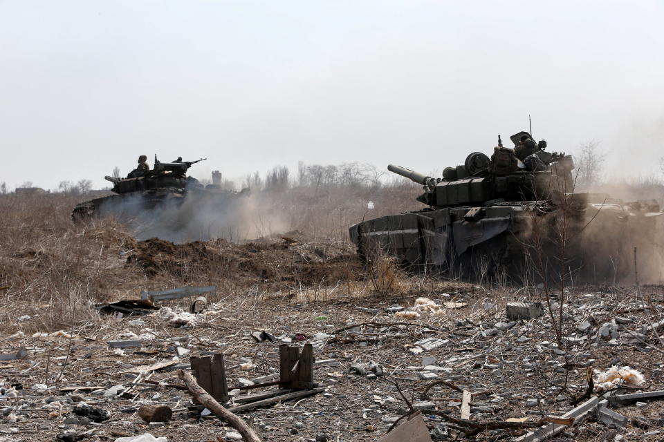 Pictured are service members of pro-Russian troops are seen atop of tanks during Ukraine-Russia conflict on the outskirts of the besieged southern port city of Mariupol, Ukraine March 20, 2022. 