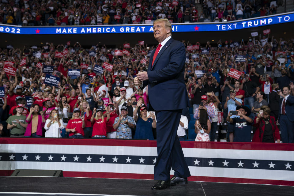 FILE - In this June 20, 2020, file photo President Donald Trump arrives on stage to speak at a campaign rally at the BOK Center in Tulsa, Okla. Trump is privately reassuring Republicans anxious about his deficits to Democrat Joe Biden, noting there are three months until Election Day and reminding them of the late-breaking events that propelled his 2016 comeback. (AP Photo/Evan Vucci, File)