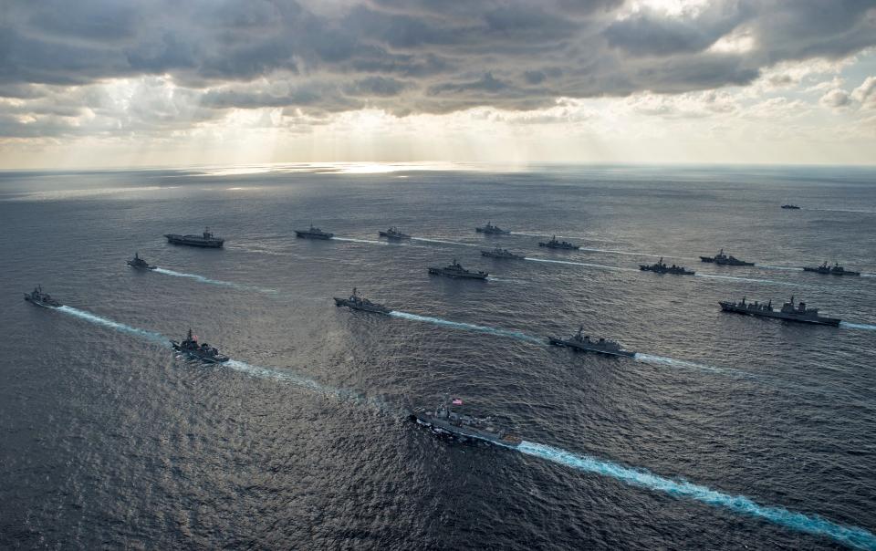 Handout photo shows U.S. Navy and Japan Maritime Self-Defense Force ships steaming in formation during their military manoeuvre exercise known as Keen Sword 15 in the sea south of Japan.