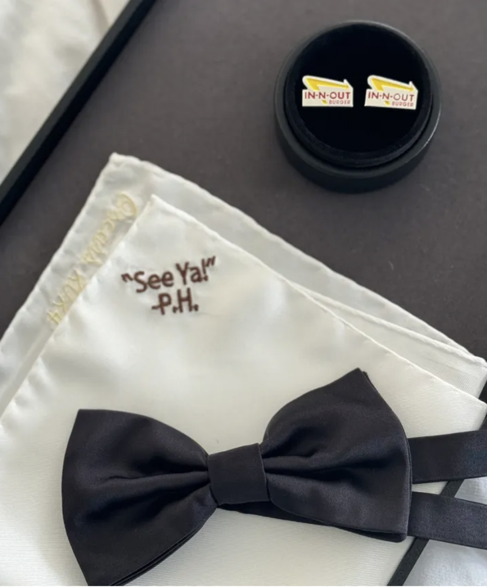 Bow tie, In-N-Out burger cufflinks, and a napkin with text 