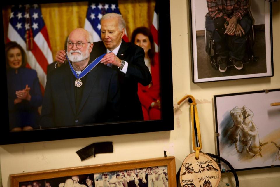 A photograph of Father Greg Boyle receiving the Presidential Medal of Freedom from President Joe Biden.