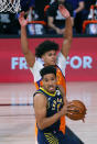 Indiana Pacers' Malcolm Brogdon (7) draws a foul from Phoenix Suns' Cameron Johnson during the second half of an NBA basketball game Thursday, Aug. 6, 2020, in Lake Buena Vista, Fla. (Kevin C. Cox/Pool Photo via AP)