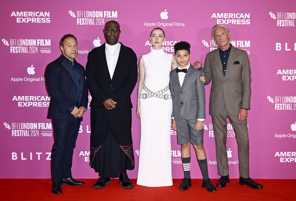 <p>Stephen Graham, Steve Mcqueen, Saoirse Ronan, Elliott Heffernan and Paul Weller pose on the Blitz red carpet. (Getty Images for BFI)</p>
