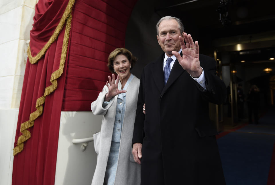 <p>Former President George W. Bush and his wife Laura Bush wave as they arrive on Capitol Hill in Washington, Friday, Jan. 20, 2017, for the presidential inauguration of Donald Trump. (Photo: Saul Loeb via AP, Pool) </p>