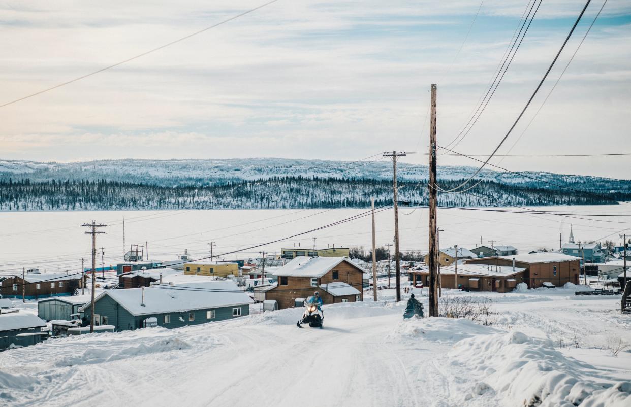 Snowmobile traffic in Łutsël K'é. (Photo: Angela Gzowski for HuffPost)