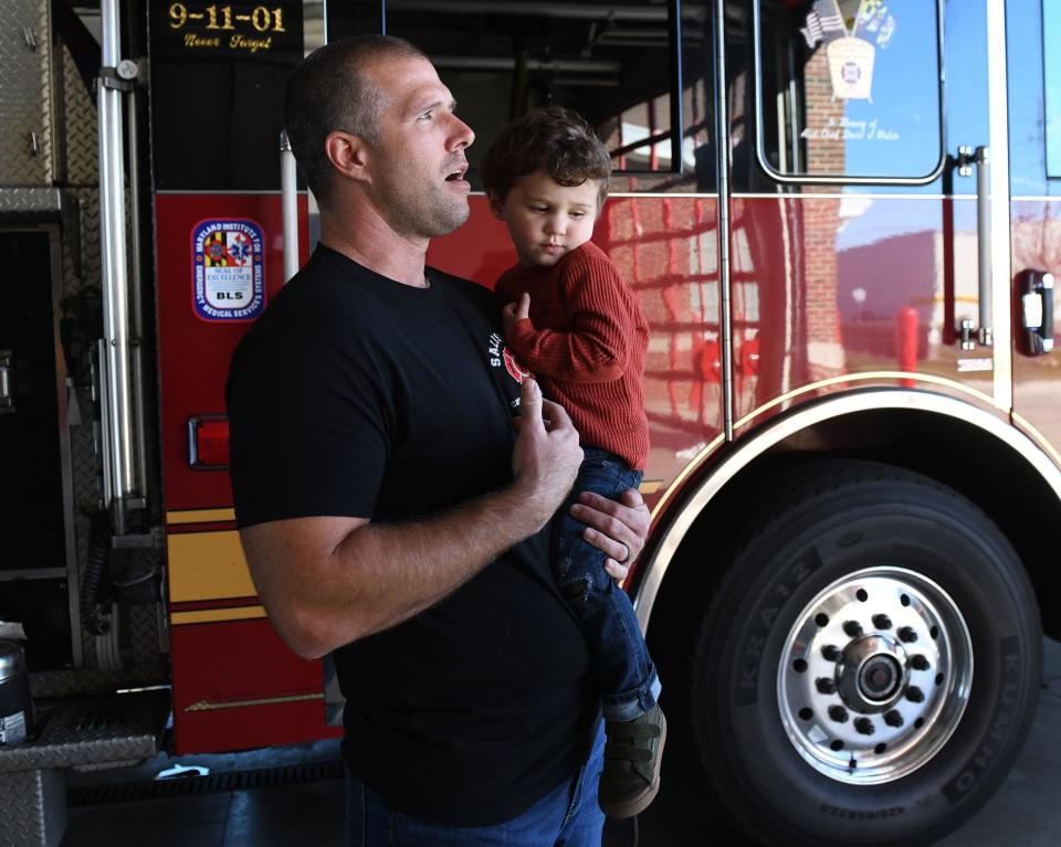 Brandon Records and his son Mason Tuesday, Nov. 14, 2023, at the Salisbury Fire Department Station 2 in Salisbury, Maryland.