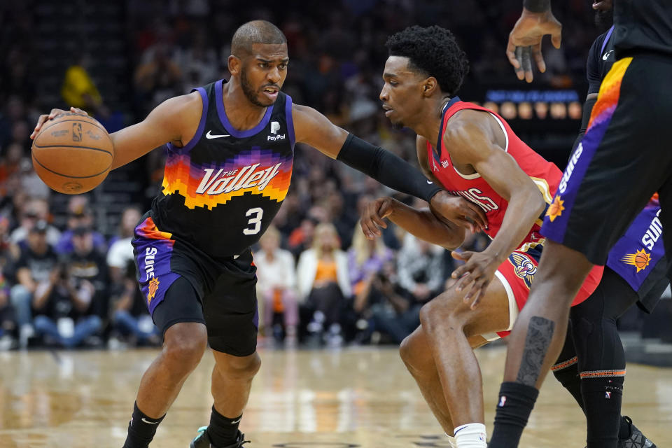 Phoenix Suns guard Chris Paul (3) drives as New Orleans Pelicans forward Herbert Jones defends during the first half of Game 1 of an NBA basketball first-round playoff series, Sunday, April 17, 2022, in Phoenix. (AP Photo/Matt York)