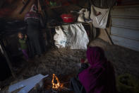 Bedouin women cook lunch at the West Bank hamlet of Khan al-Ahmar, Sunday, Jan. 22, 2023. The long-running dispute over the West Bank Bedouin community of Khan al-Ahmar, which lost its last legal protection against demolition four years ago, resurfaced this week as a focus of the frozen Israeli-Palestinian conflict. Israel's new far-right ministers vow to evacuate the village as part of a wider project to expand Israeli presence in the 60% of the West Bank over which the military has full control. Palestinians seek that land for a future state. (AP Photo/Oded Balilty)