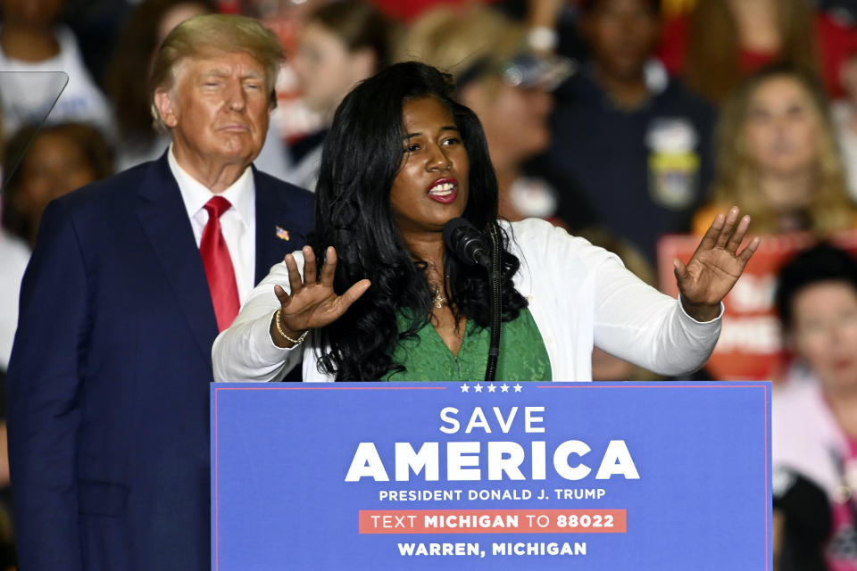 FILE - Former President Donald Trump, left, listens as Michigan Republican secretary of state candidate Kristina Karamo speaks during a rally at the Macomb Community College Sports & Expo Center in Warren, Mich., Oct. 1, 2022. Election deniers who backed Donald Trump's efforts to overturn the 2020 presidential election failed in some of their highest-profile races. (Todd McInturf/Detroit News via AP, File)