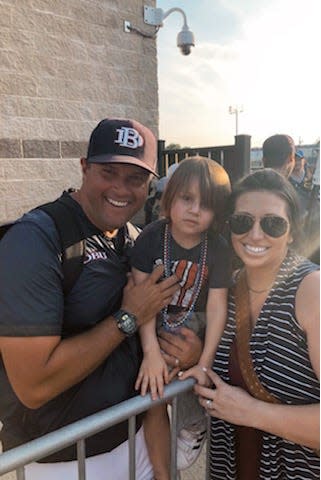 Dallas Baptist pitching coach and former NFC star Micah Posey with wife Julie and their son Maddox.