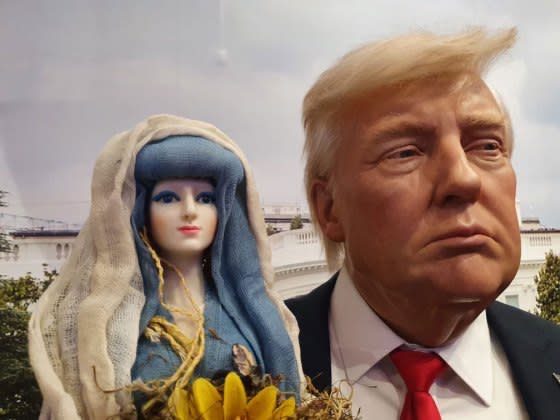 The Our Lady of the Manifest doll with a wax statue of Donald Trump<span class="copyright">Peter Lucier</span>
