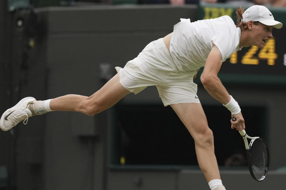 Italy's Jannik Sinner in action against Russia's Roman Safiullin during their men's singles match on day nine of the Wimbledon tennis championships in London, Tuesday, July 11, 2023. (AP Photo/Alberto Pezzali)