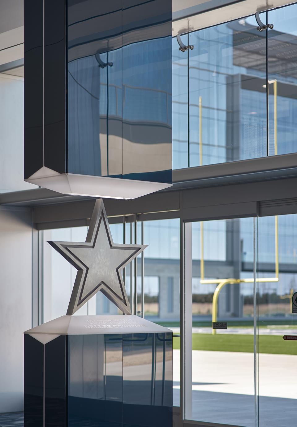 A touchstone that players pass on their way to the outdoor practice fields. The inscription reads "It is a privilege, not a right, to play, coach and work for the Dallas Cowboys."