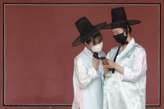 People with face coverings in South Korea