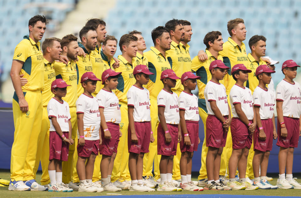 Australian players sing their national anthem at the start of the ICC Men's Cricket World Cup match between Australia and Sri Lanka in Lucknow, India, Monday, Oct. 16, 2023. (AP Photo/Aijaz Rahi)