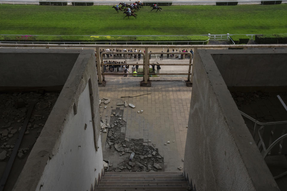 Abandoned tribunes at the Macao Jockey Club in Macao, Saturday, March 30, 2024. After more than 40 years, Macao’s horse racing track hosted its final races on Saturday, bringing an end to the sport in the city famous for its massive casinos. (AP Photo/Louise Delmotte)