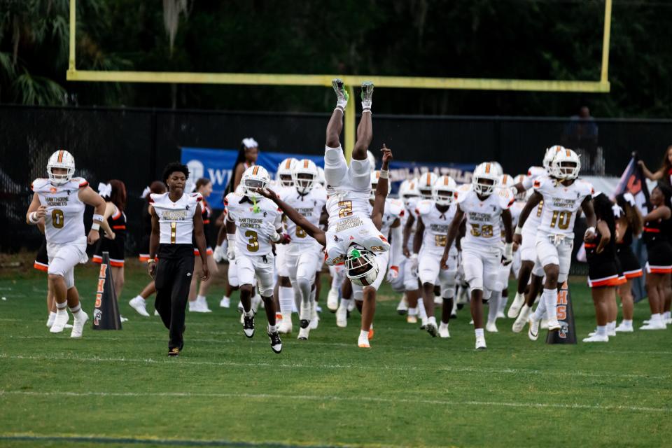 Hawthorne Hornets wide receiver Alvon Isaac (2) flips over as he run onto the field before the game against the Newberry Panthers at Newberry High School in Newberry, FL on Friday, September 1, 2023. [Matt Pendleton/Gainesville Sun]