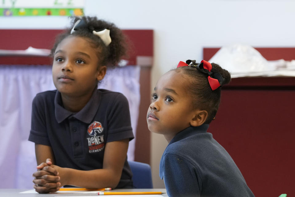 Second grade students listen during class at Schaumburg Elementary, part of the ReNEW charter network, in New Orleans, Wednesday, April 19, 2023. (AP Photo/Gerald Herbert)