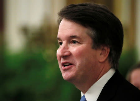 FILE PHOTO: U.S. Supreme Court Associate Justice Brett Kavanaugh speaks as he participates in a ceremonial public swearing-in in the East Room of the White House in Washington, U.S., October 8, 2018. REUTERS/Jim Bourg