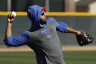 Texas Rangers' Elvis Andrus throws during spring training baseball practice Monday, Feb. 17, 2020, in Surprise, Ariz. (AP Photo/Charlie Riedel)