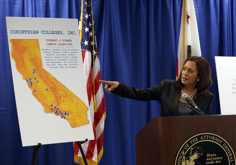 SAN FRANCISCO, CA - OCTOBER 10:  California Attorney General Kamala Harris points to a map as she speaks during a news conference on October 10, 2013 in San Francisco, California. Harris announced the filing of a lawsuit against the for-profit Corinthian Colleges and its subsidiaries for alleged false advertising, securities fraud, intentional misrepresentations to students and the unlawful use of military insignias in advertisements. Santa Ana, California-based Corinthian Colleges operates 111 total campuses in North America with 24 Heald, Everest and WyoTech colleges in California that have an estimated 27,000 students.  (Photo by Justin Sullivan/Getty Images)