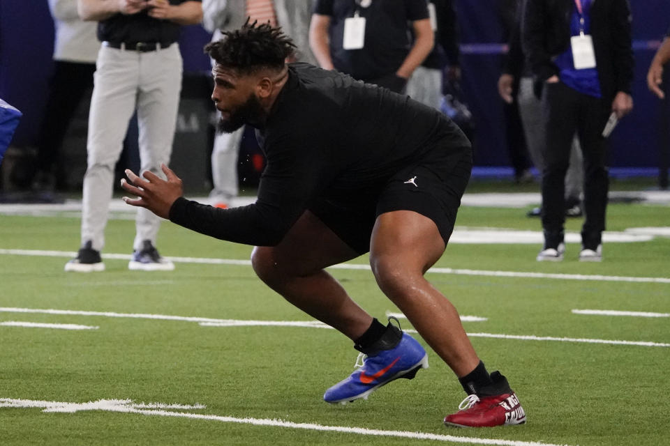 Florida offensive lineman O'Cyrus Torrence goes through a drill during an NFL football Pro Day, Thursday, March 30, 2023, in Gainesville, Fla. (AP Photo/John Raoux)