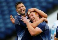 FILE PHOTO: Scotland's Ally Hogg celebrates with team mate Roddy Grant after their 19-0 victory against Argentina in the Edinburgh Sevens Plate final at Murrayfield stadium in Edinburgh.