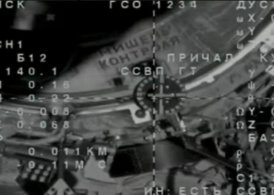 A camera on the approaching Soyuz spacecraft shows the vehicle in near-perfect alignment with a docking target on the space station's Poisk module moments before contact. / Credit: NASA/Roscosmos