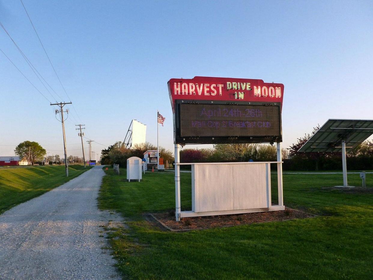 Sign for Harvest Moon Twin Drive-In Theatre on a clear day.