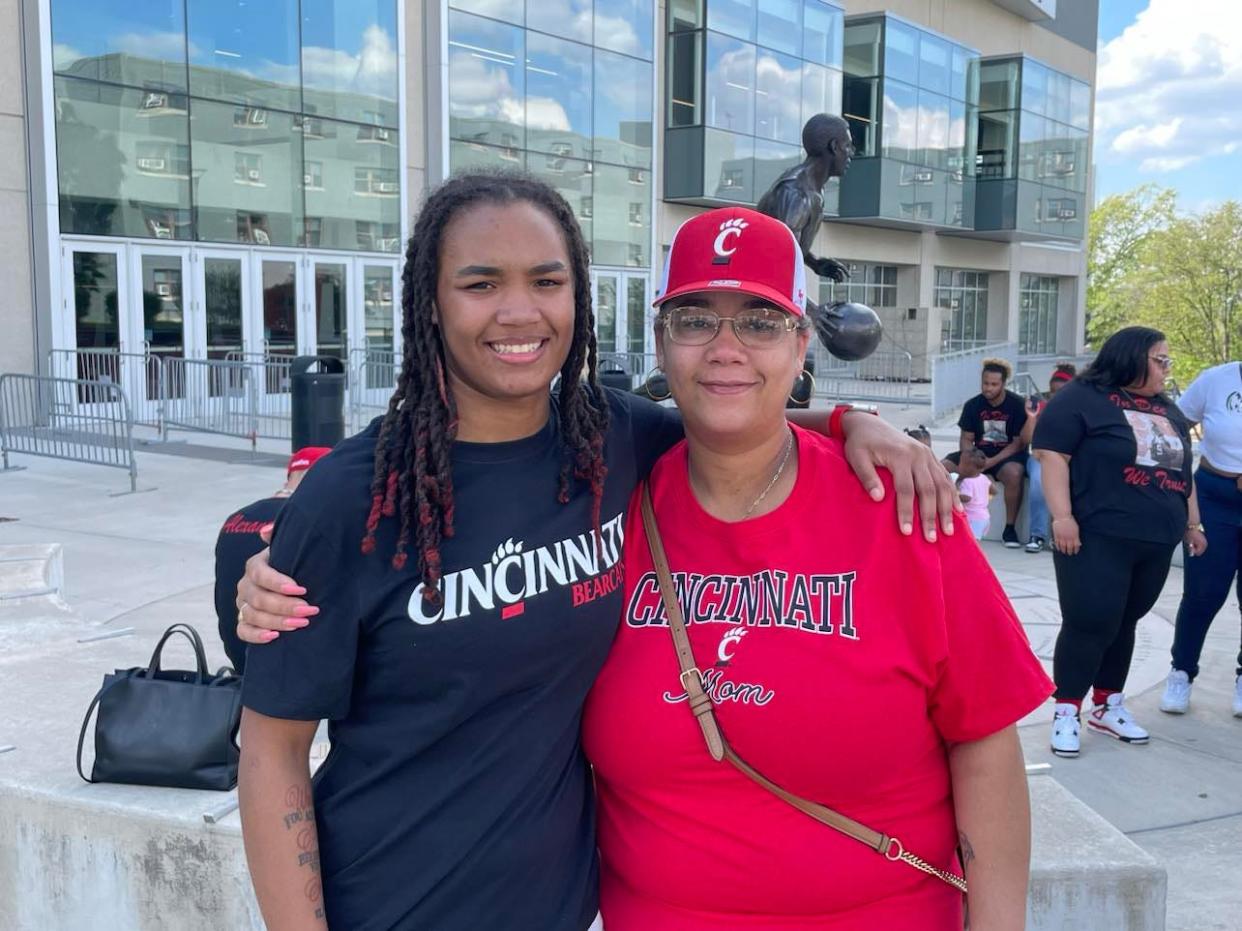 Celebrating with her mother Maria Burton, Purcell Marian's Dee Alexander announced her commitment to the University of Cincinnati women's basketball program