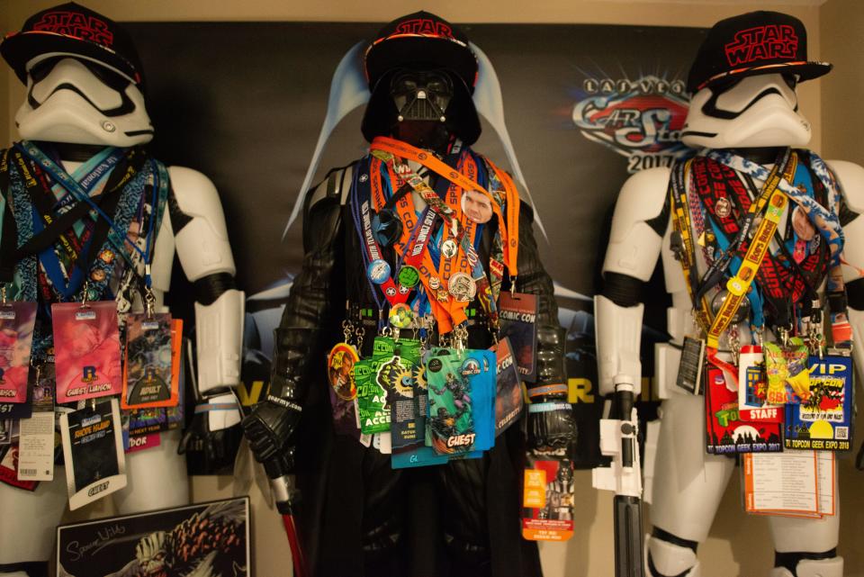 Dozens of Comic-Con lanyards and passes hang from the necks of Darth Vader and Stormtrooper figures from "Star Wars" owned by The Beast Within Productions, USA.