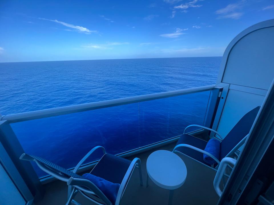 deluxe balcony stateroom on the Sky Princess view of two chairs and table