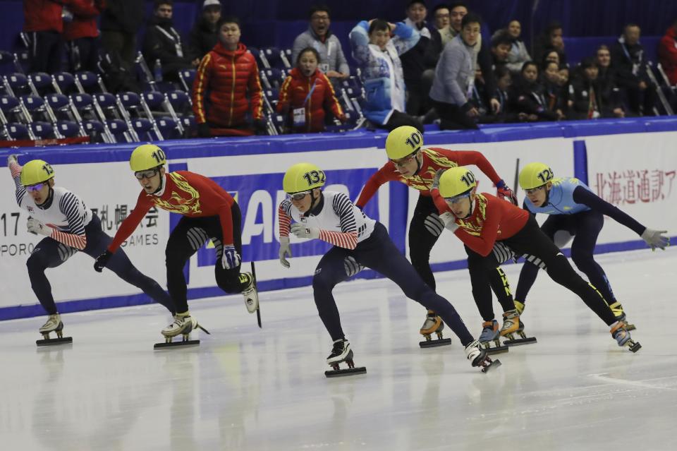 Park Se-yeong, center, of South Korea leads during the men's 1500 meters final of short track speed skating competition at the Asian Winter Games at Makomanai Indoor Skating Rink in Sapporo, northern Japan, Monday, Feb. 20, 2017. (AP Photo/Eugene Hoshiko)