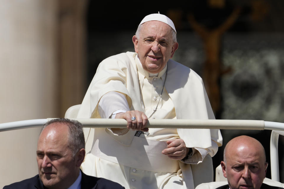 Pope Francis leaves at the end of his weekly general audience in St. Peter's Square, at the Vatican, Wednesday, April 27, 2022. (AP Photo/Andrew Medichini)