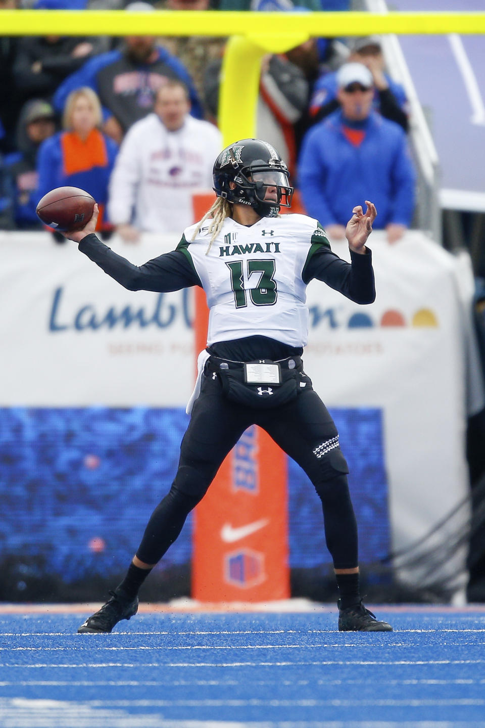 Hawaii quarterback Cole McDonald (13) looks to throw the ball against Boise State during the first half of an NCAA college football game for the Mountain West Championship Saturday, Dec. 7, 2019, in Boise, Idaho. (AP Photo/Steve Conner)