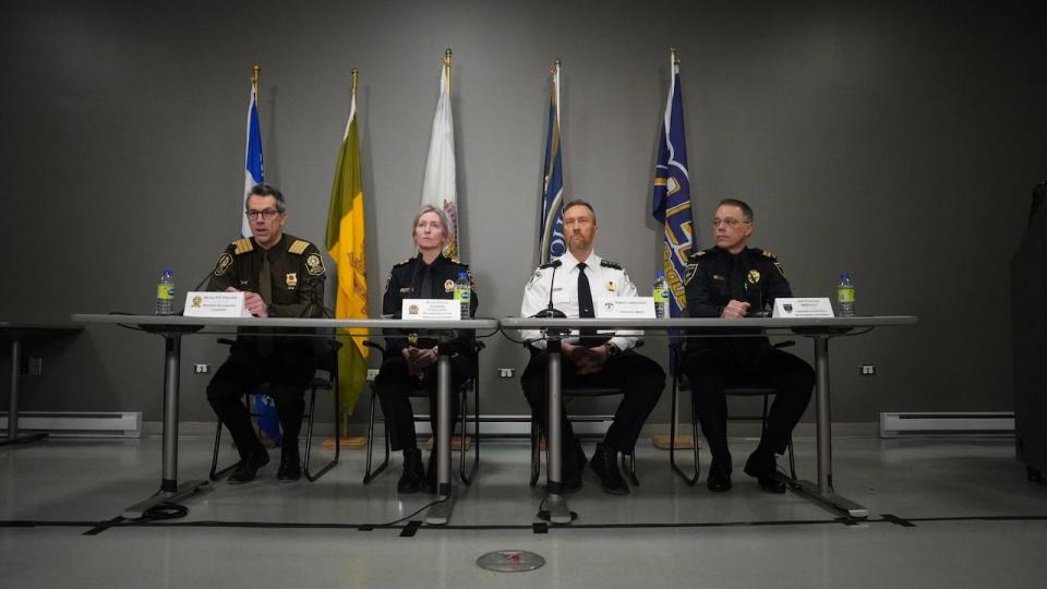 Michel Patenaude, director of cirminal investigations with the SQ, Marie-Manon Savard, in charge of investigations and specialized services for the Service de police de la Ville de Québec, Cpt. Réjean Langlois, assistant director of the Lévis Police Department and  Cpt. Jean-François Imbeault, of the Saguenay Police Department held a joint news conference.