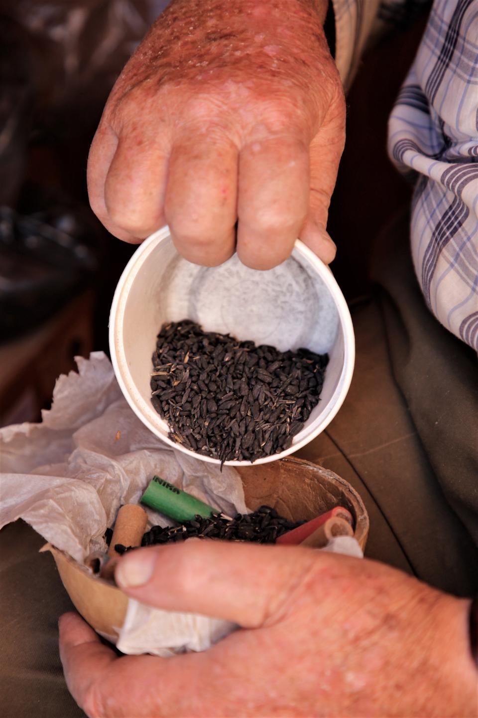 Tommy Bolack adds ignition spreader to the bottom half of a 6-inch shell as he prepares for his annual Fourth of July fireworks show from the B-Square Ranch.