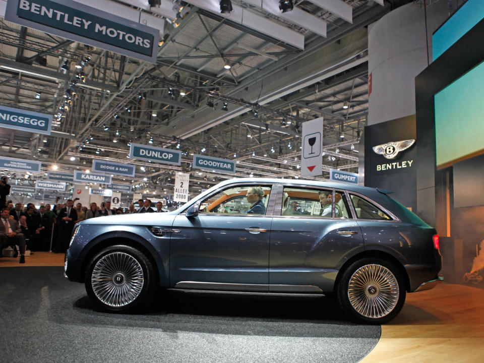 After months of rumors, Bentley revealed today a concept for its first sport utility vehicle ever: the 600-hp Bentley EXP 9 F. When it comes to vehicles for the wealthiest people in the world, restraint is so last century. With ultra-luxury vehicle sales rising on strong demand from China and the Middle East, the SUV would make the most financial sense as an addition. Given that the Continental starts around $190,000 and the Mulsanne around $280,000, it's easy to imagine a Bentley SUV with a sticker of about $250,000. Powered by a twin-turbo W-12 capable of 600 hp and 590 ft-lbs. of torque, Bentley says the EXP 9 would rank among the fastest vehicles of its kind. All that motive force gets to the ground through an 8-speed transmission and all-wheel-drive system turning 23-inch chrome wheels that are as bling-y as anything from Tire Rack. Inside lies the usual assortment of hand-stitched leathers, wood veneers and one-percentery touches like a split tailgate that folds down to reveal a custom dining set.