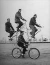 Four-man bicycle is powered by five chains and has brakes on both its wheels. The bike was built by Art Rothschild (top position) who broke three ribs while learning how to ride it. (Wallace Kirkland—Time & Life Pictures/Getty Images) <br> <br> <a href="http://life.time.com/curiosities/hell-on-wheels-in-praise-of-mutant-bicycles/#1" rel="nofollow noopener" target="_blank" data-ylk="slk:Click here to see the full collection at LIFE.com;elm:context_link;itc:0;sec:content-canvas" class="link ">Click here to see the full collection at LIFE.com</a>
