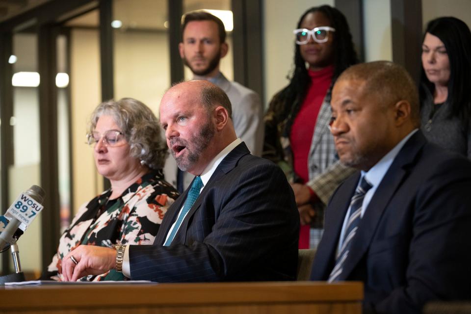 Feb 16, 2023; Columbus, Ohio, USA;  Rebecca Duran, Donovan Lewis' mother and Attorney Rex Elliott, center, speak during a press conference at Cooper Elliott Law Offices announcing a lawsuit against Columbus police officer Ricky Anderson, who shot Donovan Lewis, and four other officers who were involved with the shooting. Mandatory Credit: Brooke LaValley/Columbus Dispatch