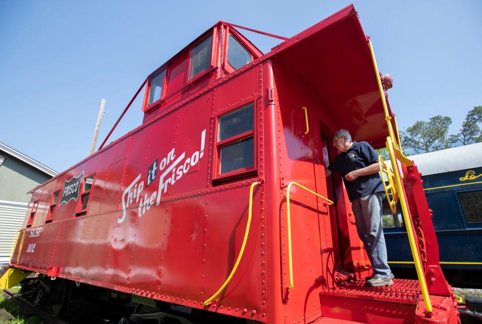 West Florida Railroad Museum President George Wilson enters the Frisco caboose at the museum in Milton on Friday.