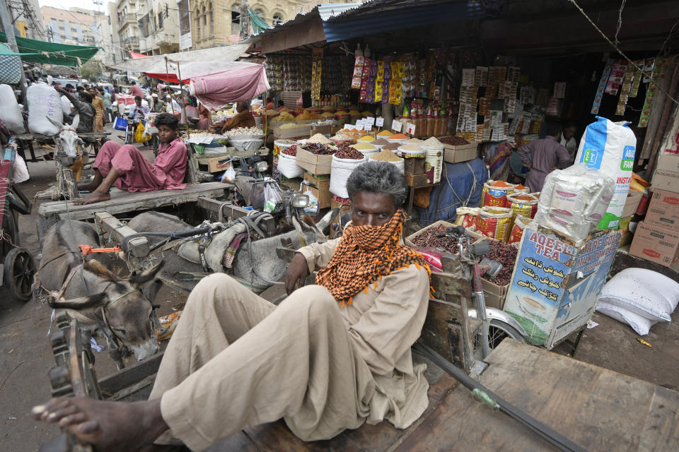Laborers waits for work at a market, in Karachi, Pakistan, Thursday, July 13, 2023. Pakistan’s finance minister on Thursday said the International Monetary Fund deposited a much-awaited first installment of $1.2 billion with the country’s central bank under a recently signed bailout aimed at enabling the impoverished Islamic nation to avoid defaulting on its debt repayments. (AP Photo/Fareed Khan)