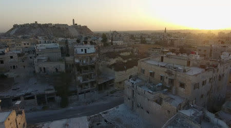 A still image from video taken October 12, 2016 of a general view of the bomb-damaged Old City area of Aleppo, Syria. REUTERS/via Reuters TV