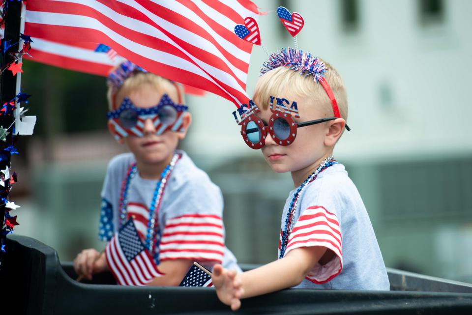 Kids dressed in American flag-themed clothing participates during the third annual Independence Day Parade in Spring Creek, Tennessee on Tuesday, Jul. 4, 2023.