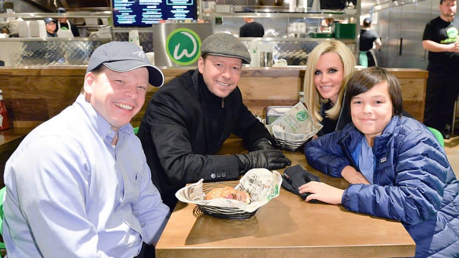 TORONTO, ON – NOVEMBER 15: Paul Wahlberg, Donnie Wahlberg, Jenny McCarthy and Elijah Wahlberg enjoy a Wahlbuger at the Canadian launch of Wahlburgers Family Restaurant on November 15, 2014 in Toronto, Canada. (Photo by George Pimentel/WireImage)