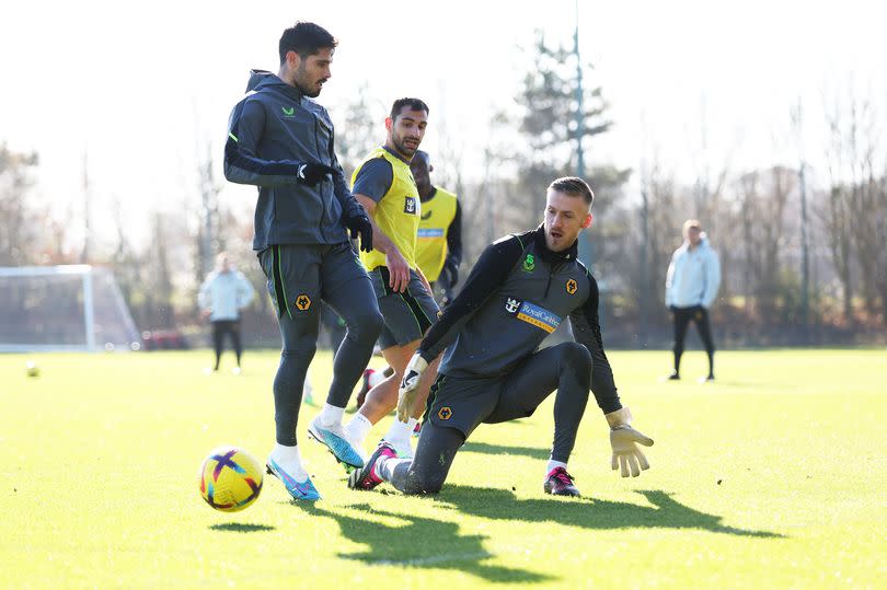 Pedro Neto has his shot saved by Dan Bentley of Wolverhampton Wanderers during a Wolverhampton Wanderers Training Session at The Sir Jack Hayward Training Ground on February 06, 2023 in Wolverhampton, England.