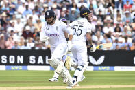 England's Jonny Bairstow, left, and England's Ben Stokes run between wickets during the third day of the fifth cricket test match between England and India at Edgbaston in Birmingham, England, Sunday, July 3, 2022. (AP Photo/Rui Vieira)