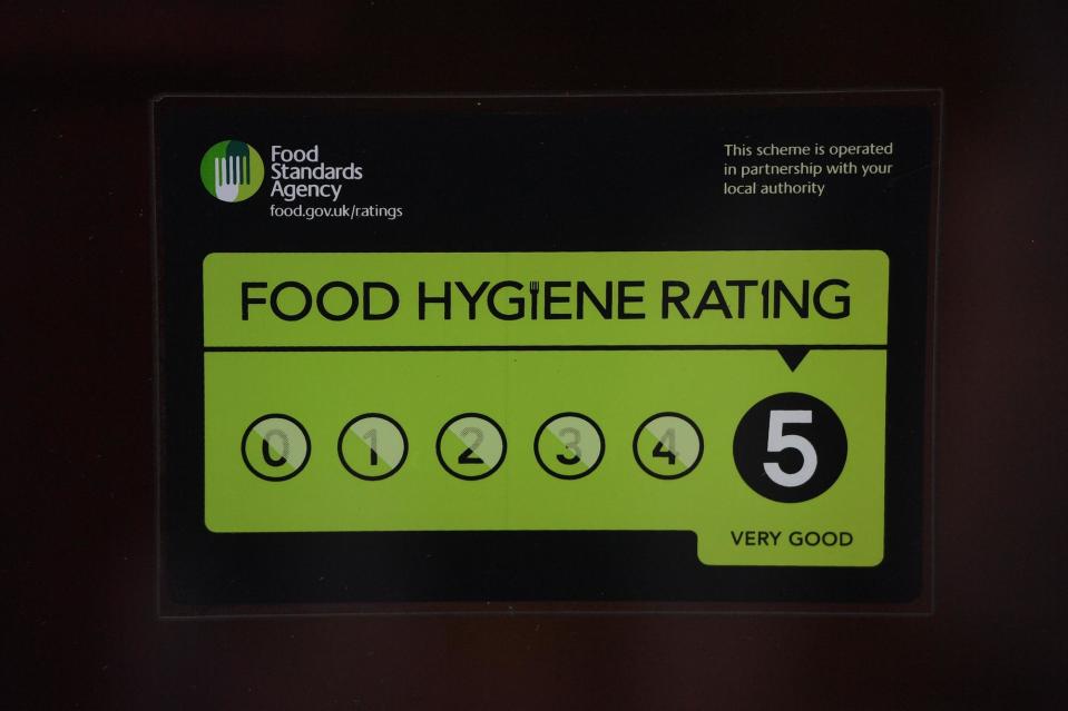 A Food Standards Agency rating sticker on a window of a restaurant in central London. A huge variation in food hygiene standards remains across the UK, with one in five high or medium-risk food outlets failing to meet standards, according to a study. (Photo: Victoria Jones)